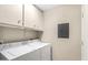 Laundry room with washer, dryer and cabinets at 11515 N 91 St # 238, Scottsdale, AZ 85260