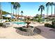 Community pool with fountain and seating area at 11515 N 91 St # 238, Scottsdale, AZ 85260