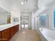 Elegant bathroom with double vanity and large shower at 11722 E Starflower Dr, Chandler, AZ 85249