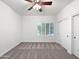 Simple bedroom with double doors and window with shutters at 11722 E Starflower Dr, Chandler, AZ 85249