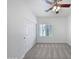 Spacious bedroom with ceiling fan, carpet, and double door closet at 11722 E Starflower Dr, Chandler, AZ 85249