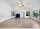 Bright living room featuring a fireplace and tile flooring at 11722 E Starflower Dr, Chandler, AZ 85249