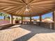 Covered patio with built-in grill, fireplace, and bar area at 11722 E Starflower Dr, Chandler, AZ 85249