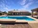 Large rectangular pool and expansive patio area at 11722 E Starflower Dr, Chandler, AZ 85249