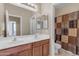 Bathroom with double sinks and shower/tub combo at 1179 E Coyote Creek Way, San Tan Valley, AZ 85143