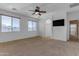 Bright bedroom featuring carpet and ceiling fan at 1179 E Coyote Creek Way, San Tan Valley, AZ 85143