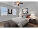 Main bedroom with plush bedding and window coverings at 1179 E Coyote Creek Way, San Tan Valley, AZ 85143