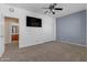 Bright bedroom with ceiling fan and large closet at 1179 E Coyote Creek Way, San Tan Valley, AZ 85143