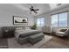 Spacious bedroom with large windows and ceiling fan at 1179 E Coyote Creek Way, San Tan Valley, AZ 85143