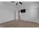 Simple bedroom with ceiling fan and large closet at 1179 E Coyote Creek Way, San Tan Valley, AZ 85143