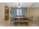 Dining area with a wooden table and bench seating at 1179 E Coyote Creek Way, San Tan Valley, AZ 85143