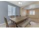 Dining area with a wooden table and bench seating at 1179 E Coyote Creek Way, San Tan Valley, AZ 85143