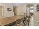 Dining area with a wooden table and bench seating at 1179 E Coyote Creek Way, San Tan Valley, AZ 85143