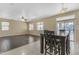 Bright dining room with hardwood floors and sliding door to patio at 1179 E Coyote Creek Way, San Tan Valley, AZ 85143