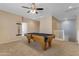 Game room with pool table, carpet flooring, and ceiling fan at 1179 E Coyote Creek Way, San Tan Valley, AZ 85143