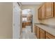 Spacious kitchen with an island, stainless steel appliances, and ample cabinetry at 1179 E Coyote Creek Way, San Tan Valley, AZ 85143