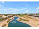 Aerial view of a lakefront community with golf course views at 1179 E Coyote Creek Way, San Tan Valley, AZ 85143