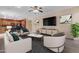 Living room features a fireplace, hardwood floors, and plenty of natural light at 1179 E Coyote Creek Way, San Tan Valley, AZ 85143