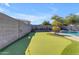 Private putting green in the backyard, perfect for leisure at 1179 E Coyote Creek Way, San Tan Valley, AZ 85143