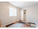 Bedroom with large window, closet with sliding door, and colorful rug at 1240 W Straford Dr, Chandler, AZ 85224