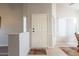 Welcoming entryway with neutral walls, tile flooring, and natural light filtering through the window with slatted blinds at 1240 W Straford Dr, Chandler, AZ 85224