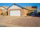 Charming single-story home featuring a two-car garage, brick accents, and low-maintenance landscaping at 1240 W Straford Dr, Chandler, AZ 85224