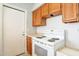 Well-lit kitchen featuring essential appliances, including a range with oven and plentiful cabinet space for organized storage at 1240 W Straford Dr, Chandler, AZ 85224