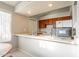 This cozy kitchen offers ample counter space and cabinet storage beneath recessed lighting for a practical cooking experience at 1240 W Straford Dr, Chandler, AZ 85224