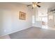 Spacious living room with neutral colors and a view into the dining area, ideal for entertaining at 1240 W Straford Dr, Chandler, AZ 85224