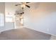 Open-concept living area with neutral walls offering seamless transition to kitchen and dining spaces at 1240 W Straford Dr, Chandler, AZ 85224