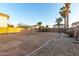 Large backyard with gravel border and palm trees at 12833 W Laurel Ln, El Mirage, AZ 85335