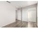 Bedroom with wood-look floors and double closets at 12833 W Laurel Ln, El Mirage, AZ 85335