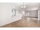 Bright dining area with tile floors and kitchen island at 12833 W Laurel Ln, El Mirage, AZ 85335