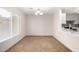 Bright dining area with tile floors and kitchen views at 12833 W Laurel Ln, El Mirage, AZ 85335