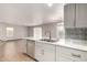 Spacious kitchen with marble countertops and stainless steel dishwasher at 12833 W Laurel Ln, El Mirage, AZ 85335