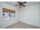 Simple bedroom with carpeted floor and window at 13403 W Cabrillo Dr, Sun City West, AZ 85375