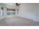 Bright bedroom with neutral carpeting and large windows at 13403 W Cabrillo Dr, Sun City West, AZ 85375