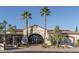 Community clubhouse entrance with palm trees at 13403 W Cabrillo Dr, Sun City West, AZ 85375