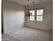 Bright dining room with neutral walls, carpet, and a decorative chandelier at 13403 W Cabrillo Dr, Sun City West, AZ 85375