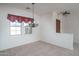 Bright dining room features a chandelier and window coverings at 13403 W Cabrillo Dr, Sun City West, AZ 85375