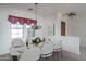 Elegant dining room with chandelier and marble table at 13403 W Cabrillo Dr, Sun City West, AZ 85375