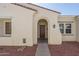 Front entryway with arched top and dark brown door at 13403 W Cabrillo Dr, Sun City West, AZ 85375