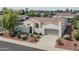 One-story home with tile roof, arched entry, and two-car garage at 13403 W Cabrillo Dr, Sun City West, AZ 85375