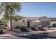 Single-story home with arched entryway and landscaped yard at 13403 W Cabrillo Dr, Sun City West, AZ 85375