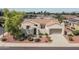 Spanish style home with tile roof, landscaping, and a two-car garage at 13403 W Cabrillo Dr, Sun City West, AZ 85375