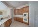 Kitchen with wood cabinets and built-in microwave at 13403 W Cabrillo Dr, Sun City West, AZ 85375