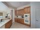 Kitchen with wood cabinets and built-in microwave at 13403 W Cabrillo Dr, Sun City West, AZ 85375