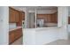 Kitchen boasts wood cabinets and a large island at 13403 W Cabrillo Dr, Sun City West, AZ 85375