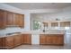 Kitchen with wood cabinets and modern appliances at 13403 W Cabrillo Dr, Sun City West, AZ 85375