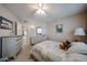 Comfortable bedroom featuring neutral walls, carpet flooring, and a view into the hall at 13861 N 111Th Ave, Sun City, AZ 85351